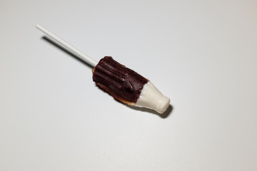 Coke bottle-shaped cola flavored lollipops
