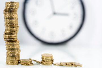 TIME IS MONEY concept: Alarm clock and with coins