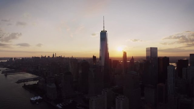 New York City popular modern skyline cityscape in warm evening orange sunset in gorgeous drone aerial panorama flyover