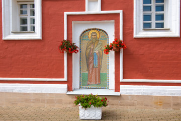 Fototapeta na wymiar LUGOVOY (DMITROV DISTRICT), RUSSIA- AUGUST 20 2019: Mosaic icon of Methodius Peshnoshsky on the wall in the Nikolo-Peshnoshsky Monastery. Caption: Do not blame anyone for this is your downfall.