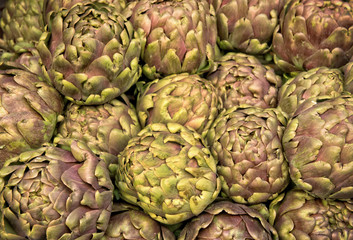 Fototapeta premium Group of artichokes at the market background