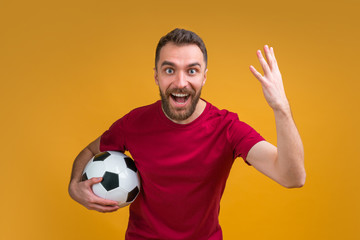 Young attractive bearded man betting at bookmaker's website