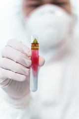 Focused photo on male hand that holding test tube