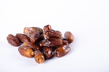 Oriental dates in the middle on white backdrop. 