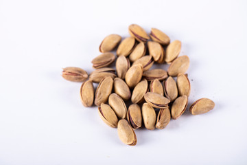 Pistachios in the middle of a white background