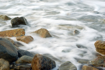 Naklejka na ściany i meble Turbulence sea water and rock at Coastline