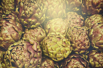 Fototapeta premium Group of artichokes at the market background