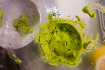 Preparing guacomole in a kitchen