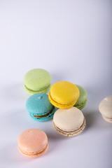 Macarons randomly selectd and put on white background. top view