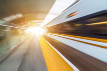 speeding train away from railway station