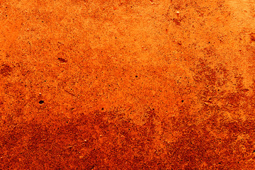 Old plaster on the wall. Abstract red-orange background.