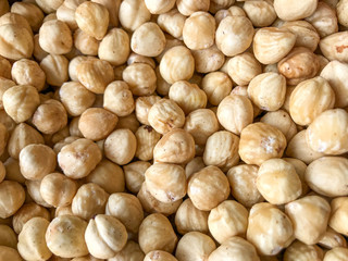 Close-Up Of Peeled Hazelnuts. Healthy Fresh Food Background.