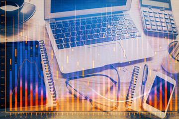 Double exposure of chart and financial info and work space with computer background. Concept of...
