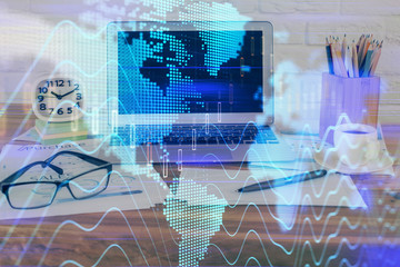 Financial graph colorful drawing and table with computer on background. Multi exposure. Concept of international markets.