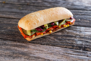 sandwich with salami and vegetables