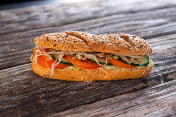 vegeterian sandwich with tomato, cucumber and sprouts