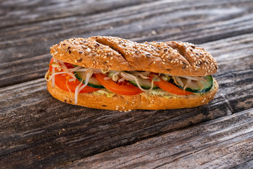 vegeterian sandwich with tomato, cucumber and sprouts