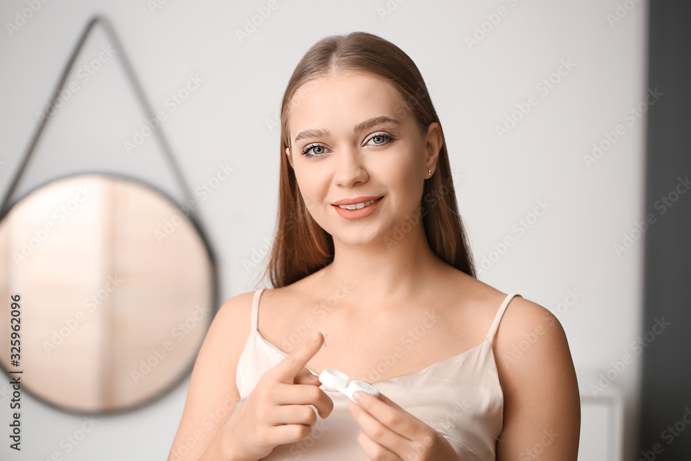 Canvas Prints Young woman with contact lens and case at home