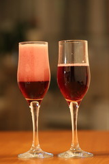 two glasses of sparkling wine, congratulating women on the holiday