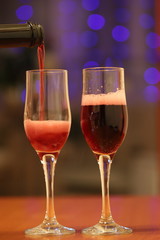 two glasses of sparkling wine, congratulating women on the holiday