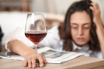 Obraz na płótnie Canvas Woman drinking wine at home. Concept of alcoholism