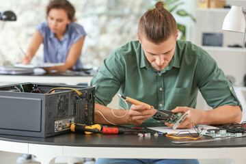 Electronic technician working in service center