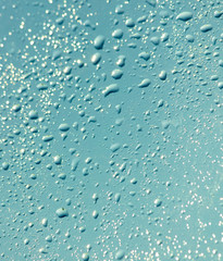 Drops of water on a blue glass window