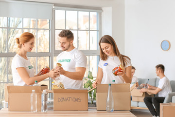 Team of volunteers with products indoors