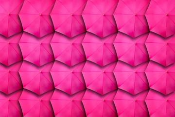 Pink umbrella pattern arrangement. Top view creative umbrella background. Nobody. Classic brolly wallpaper © CrispyMedia