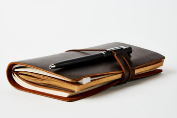 Business contact book and pen, close-up