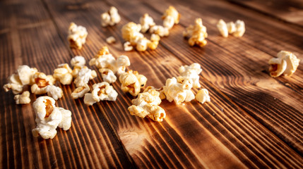 Popcorn flakes on a wooden background