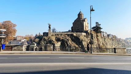 Fototapeta na wymiar TBILISI, GEORGIA DECEMBER 14, 2019: Old Tbilisi architecture, Metekhi church in Tbilisi, Georgia