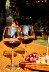 Glasses Of Fine Red Wine With Grape and cheese