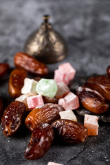 Turkish lokum with oriental dates on a piece of marble