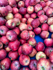 Organic red apples in the market stall
