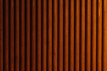 brown wood panel with abstract vertical lines pattern