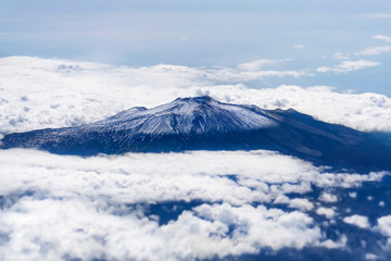 Fototapeta na wymiar Etna mount covered in snow. Aerial view from above
