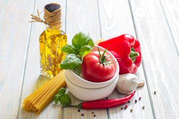 Composition with pasta cooking ingredients on wooden table in the kitchen still life art food