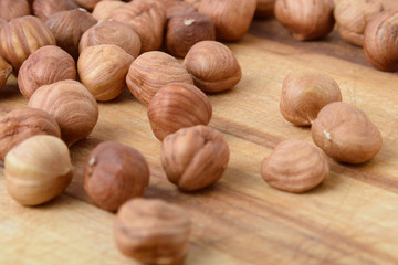 Ripe hazelnuts in bulk on a wooden table