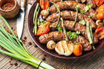 Sausages fried with vegetable