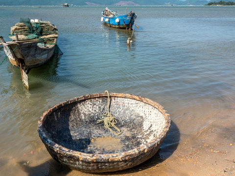 Growing oyster on car tires over poles in Vietnam