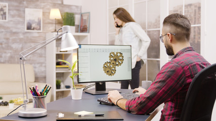 Back view of male engineer working on a mechanical concept