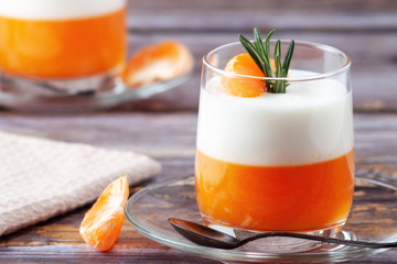 Panna Cotta with tangerines, jelly and rosemary, Italian dessert, home cooking. Copy space