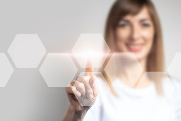 young girl points a finger at the virtual screen, icons are added on a light background. Banner. Concept business and digital technology