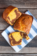 Two-colour soft cake on antique wooden table