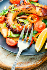 Vegetable salad with octopus.