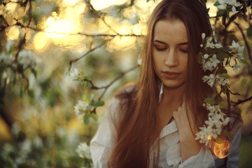 Naklejka premium Brunette with long strong beautiful hair summer photo