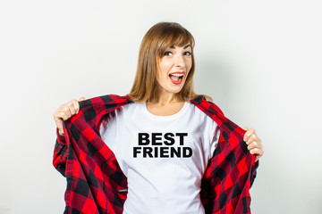 Young woman with a smile in a red shirt and white t-shirt on a white background. T-shirt Best...