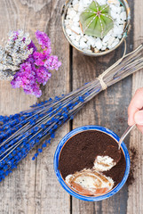 Top view of a homemade tiramisu in a pot on a wooden table 