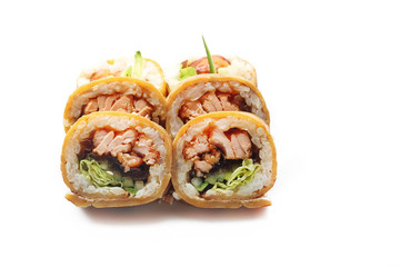 Sushi with salmon, cucumber and avocado wrapped in a tamago nigiri omelette. Sushi on a white background